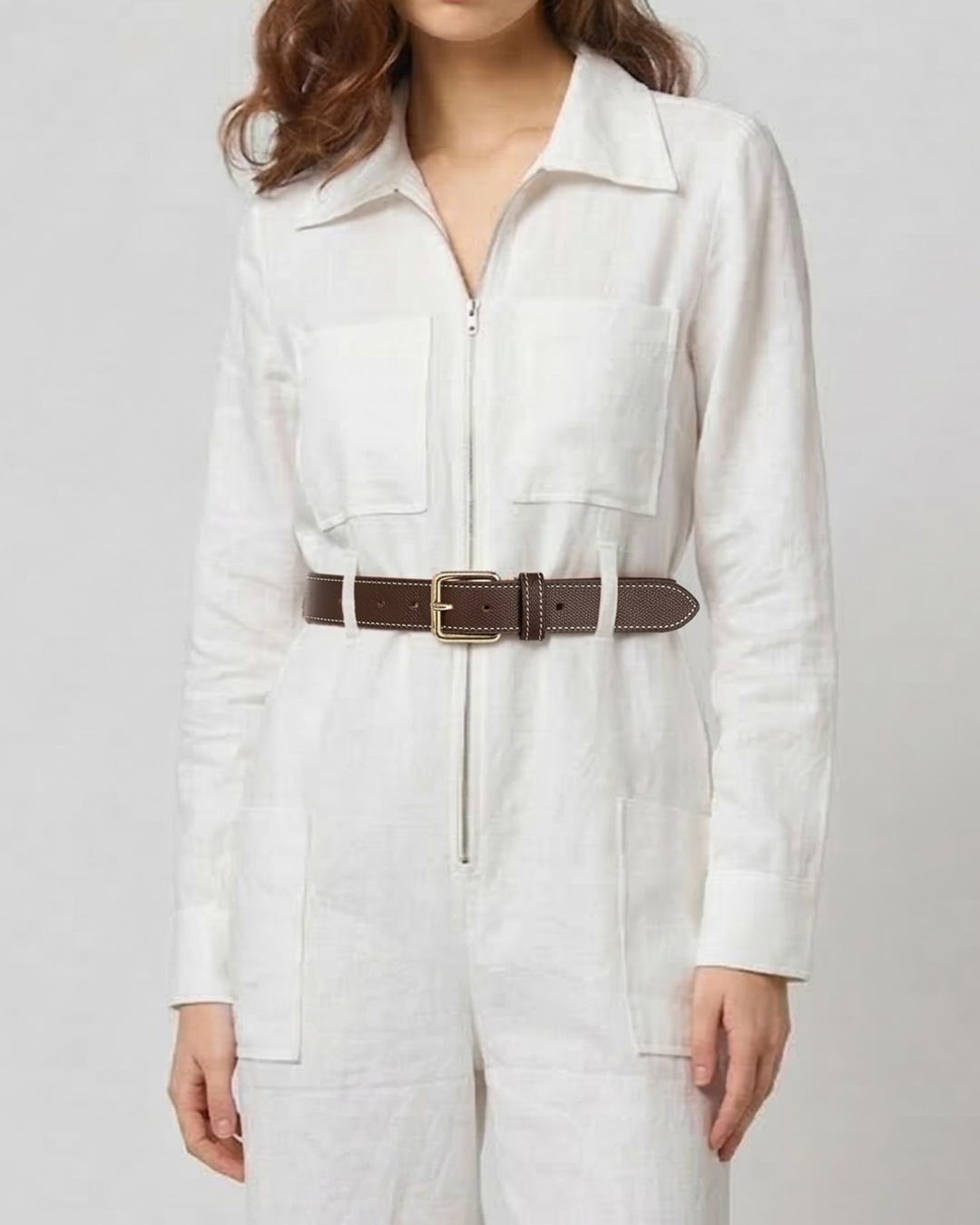 Close up of belt detail on AERAA off white utility jumpsuit