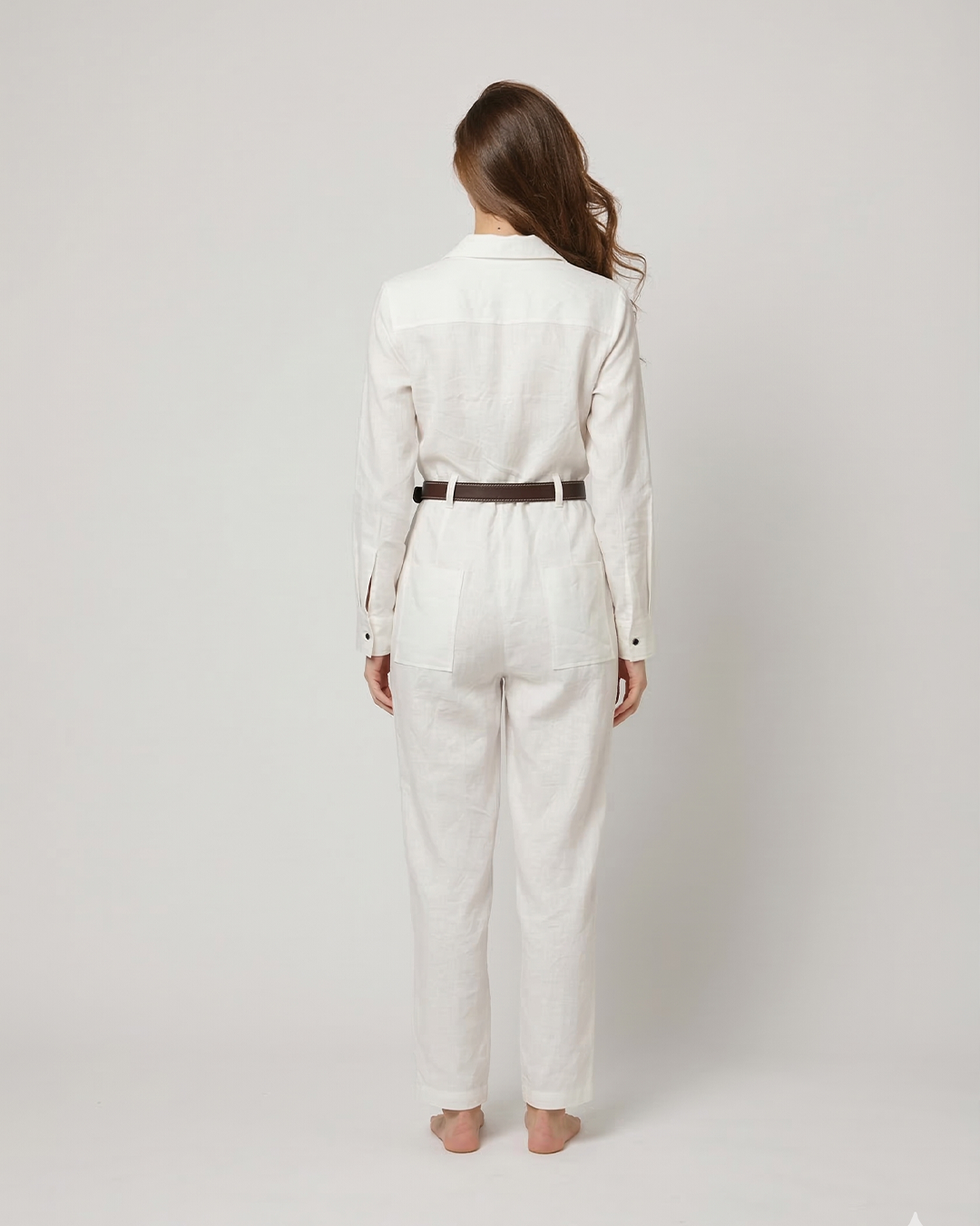 Back view of AERAA off white full length utility jumpsuit
