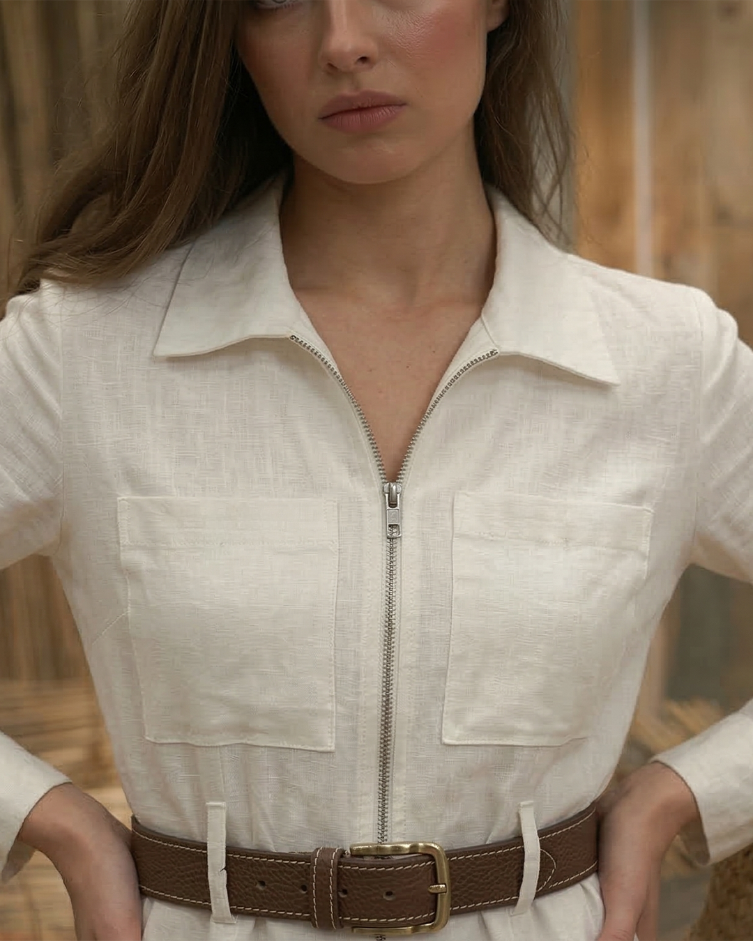 Front zip closure detail of AERAA utility jumpsuit